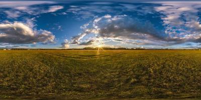 full seamless spherical hdri panorama 360 degrees angle view among fields in summer evening sunset with beautiful clouds in equirectangular projection, ready for VR AR virtual reality photo