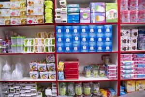 Colorful Varieties Plastic houseware products on the supermarket Shelf photo