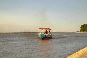 12 July 2022 Traditional Travel Boat in Padma river - Bangladesh photo