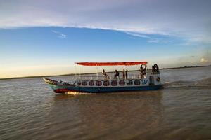 12 July 2022 Traditional Travel Boat in Padma river - Bangladesh photo