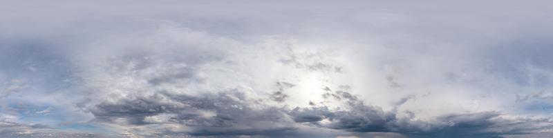 blue sky with beautiful fluffy cumulus clouds. Seamless hdri panorama 360 degrees angle view without ground for use in 3d graphics or game development as sky dome or edit drone shot photo