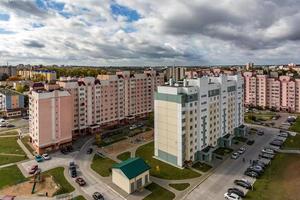 Panoramic view on new quarter high-rise building area urban development residential quarter in the cloudy autumn from a bird's eye view. life in a big city photo