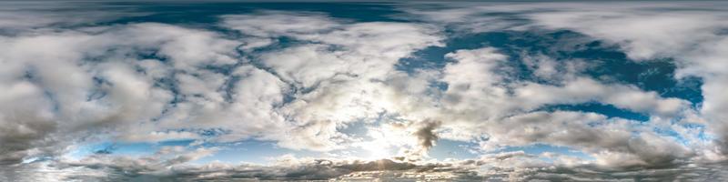 blue sky with beautiful cumulus clouds. Seamless hdri panorama 360 degrees angle view with zenith for use in 3d graphics or game development as sky dome or edit drone shot photo