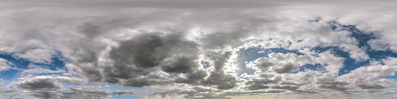 Seamless hdri panorama 360 degrees angle view blue sky with beautiful fluffy cumulus clouds with zenith for use in 3d graphics or game development as sky dome or edit drone shot photo