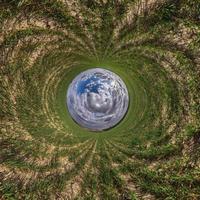 Blue little planet. Inversion of tiny planet transformation of spherical panorama 360 degrees. Spherical abstract aerial view. Curvature of space. photo