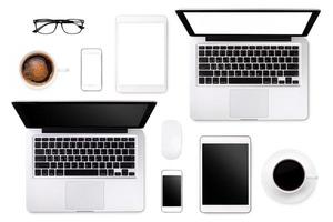 Laptop tablet smartphone eyeglass and coffee on white background with text space and copy space photo