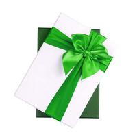 White gift Box with green ribbon Isolated on white background photo