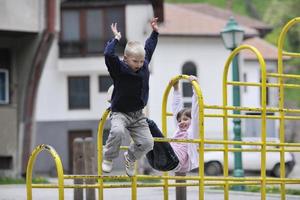 happy brother and sister outdoor in park photo