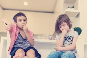 cute little brother and sister at home photo