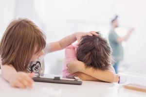 cute little brother and sister having fun at home photo