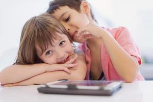 cute little brother and sister having fun at home photo