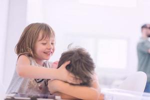 cute little brother and sister having fun at home photo