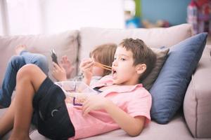 cute little brother and sister having fun at home photo