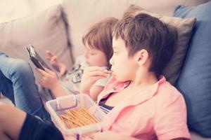 cute little brother and sister having fun at home photo