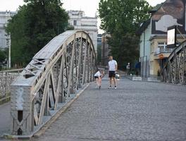 couple warming up and stretching before jogging photo