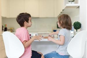 cute little brother and sister at home photo