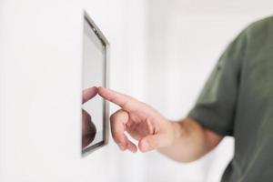 smart home and technology concept close up of male hands photo