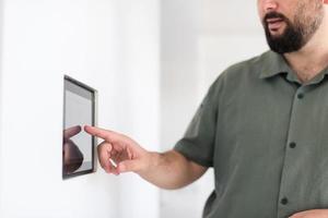 smart home and technology concept close up of male hands photo