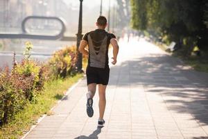 man jogging at sunny morning photo