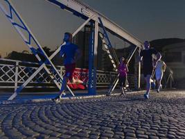 young people jogging across the bridge photo