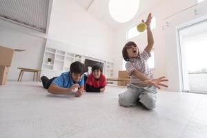 boys having fun with an apple on the floor photo