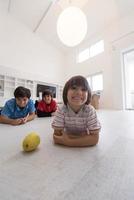 boys having fun with an apple on the floor photo