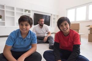 portrait of happy young boys with their dad photo