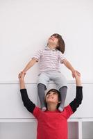 young boys posing line up piggyback photo