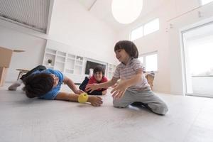 boys having fun with an apple on the floor photo