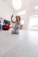 boys having fun with an apple on the floor photo