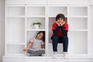 young boys posing on a shelf photo