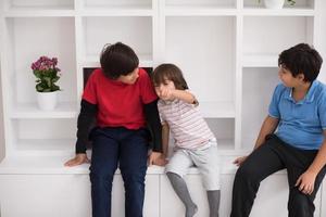 young boys posing on a shelf photo