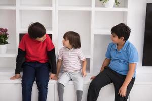 young boys posing on a shelf photo