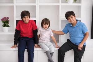 young boys posing on a shelf photo