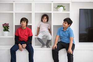 young boys posing on a shelf photo