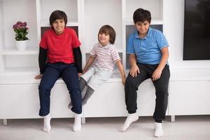 young boys posing on a shelf photo