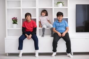 young boys posing on a shelf photo