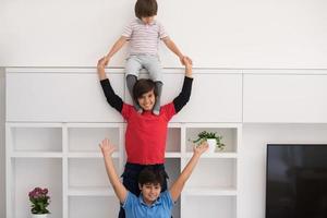 young boys posing line up piggyback photo