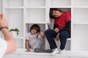 young boys posing on a shelf photo