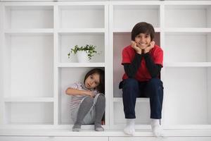 young boys posing on a shelf photo