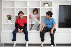 young boys posing on a shelf photo