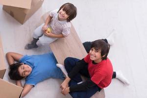 boys with cardboard boxes around them top view photo