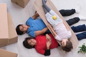 boys with cardboard boxes around them top view photo