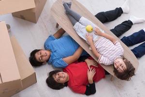 boys with cardboard boxes around them top view photo