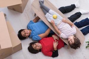 boys with cardboard boxes around them top view photo