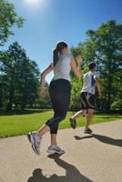 Young couple jogging at morning photo