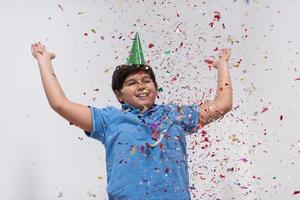 kid blowing confetti photo