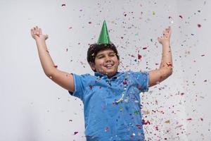 kid blowing confetti photo