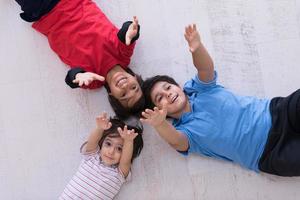 young boys having fun on the floor photo