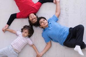 young boys having fun on the floor photo